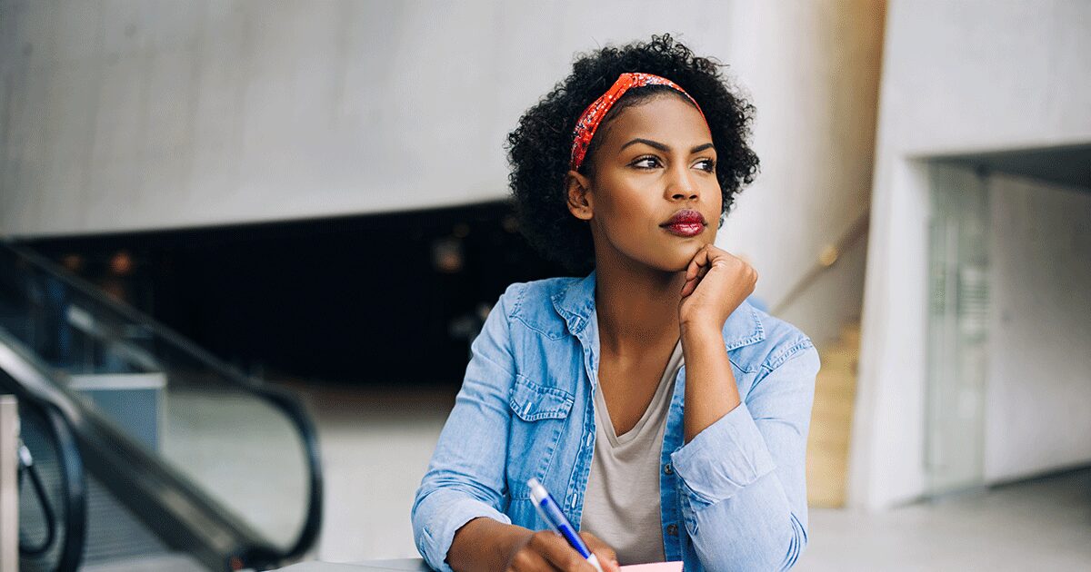 Woman reflecting on her pregnancy options before making an informed decision.